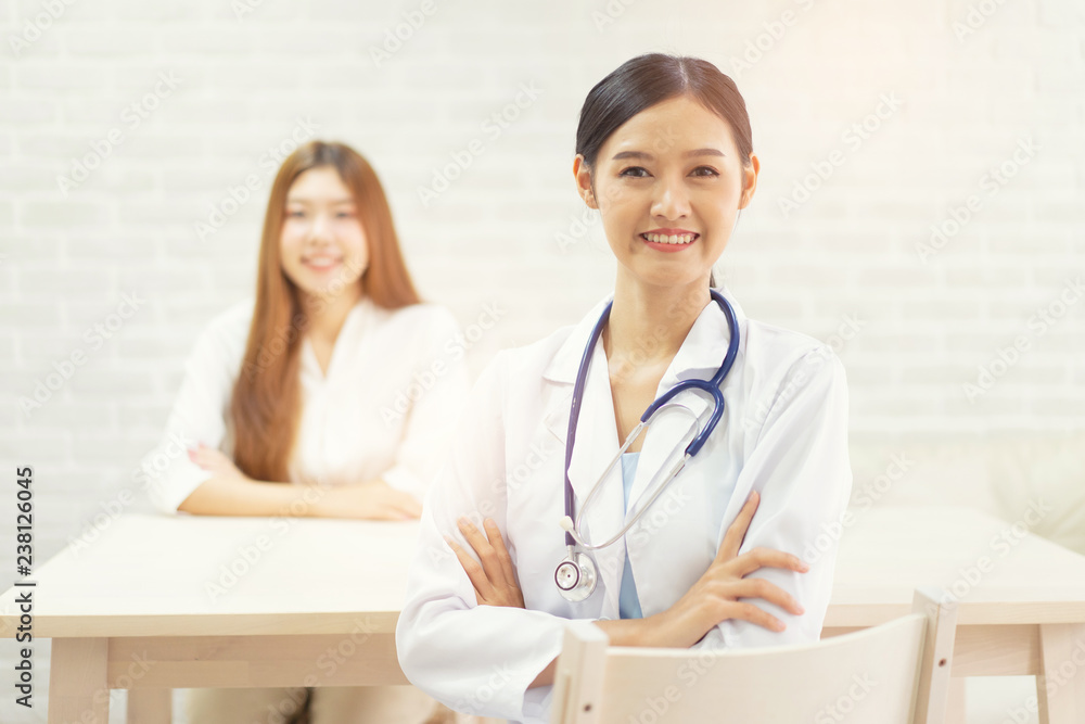 Female doctor talking to patient.Doctor and patient discussing something while sitting at the table . Medicine and health care concept. Doctor and patient Female doctor talking to patient.Doctor and patient discussing something while sitting at the table . Medicine and health care concept. Doctor and patient