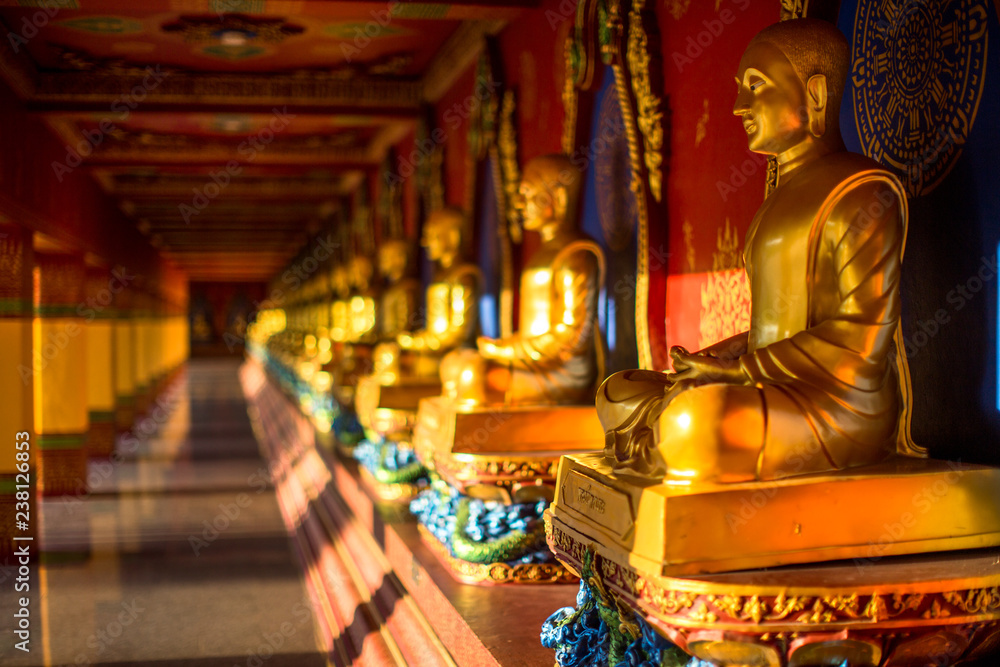 Fototapeta premium Wat Mahathat Wachiramongkol Former name (Wat Bang Tong) is located Krabi,The environment is rubber plantation. And oil palm plantation, a towering pagoda is beautiful, tourists are always watching.
