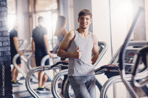 A man rejoices with his result on the treadmill