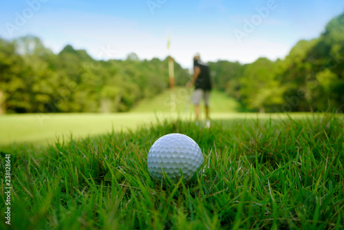Golf ball on green in beautiful golf course at sunset background. Golf ball on green in golf course at Thailand