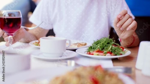Wallpaper Mural Woman eating pilaf in an outdoor cafe. Street Cafe. 4k Torontodigital.ca