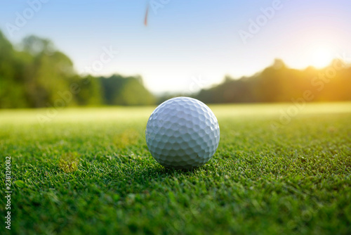 Golf ball on green in beautiful golf course at sunset background. Golf ball on green in golf course at Thailand