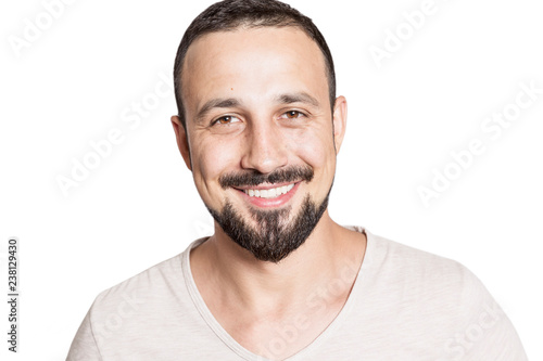 Cute laughing young male with beard isolated on white background