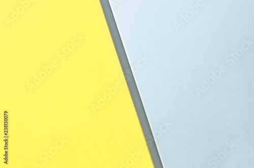 Metal splitted by a line gray yellow color background of modern siding house wall.