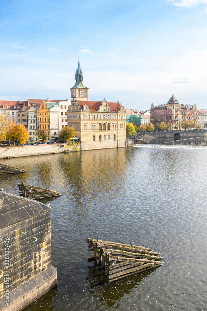 Obraz premium prague river bank and old town at background, czech republic