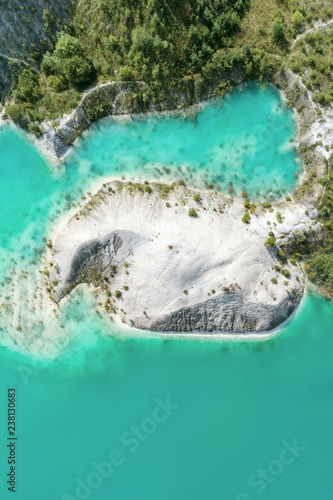 The shores of the mountain lake, the blue water in the lake. Aerial view, from top to bottom