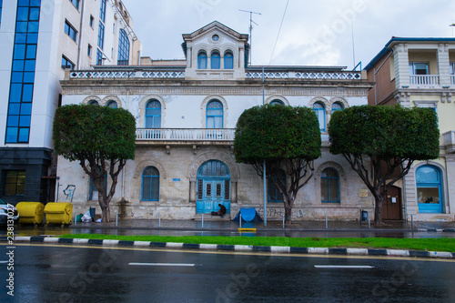 Nature and buildings on island. Travel photo 2018. December, trees and sun.