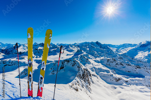 Ski in winter season, mountains and ski touring backcountry equipments on the top of snowy mountains in sunny day, Verbier Switzerland.