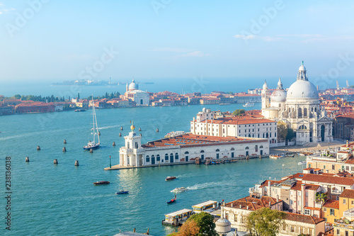 Aerial view of Venice, Santa Maria della Salute with Guidecca during early morning summer day. World famous Venice landmark. View from St Mark Campanile.