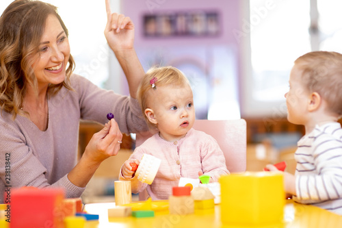 Educator and little childre...