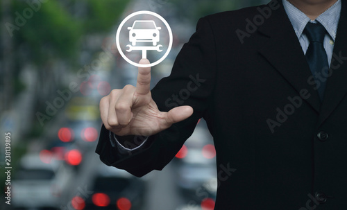 Businessman pressing service fix car with wrench tool flat icon over blur of rush hour with cars and road in city, Business repair car concept