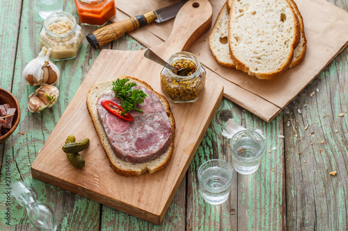 Tableau sur toile Headcheese sandwich on a cutting board, copy space