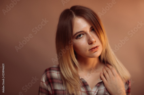 portrait smiling girl on orange background in studio