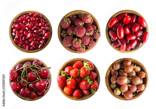 Set of strawberries, cherries, raspberries, cornels, gooseberries and pomegranate seeds. Sweet and juicy berry with copy space for text. Ripe berries close-up. Background berry. Red food.