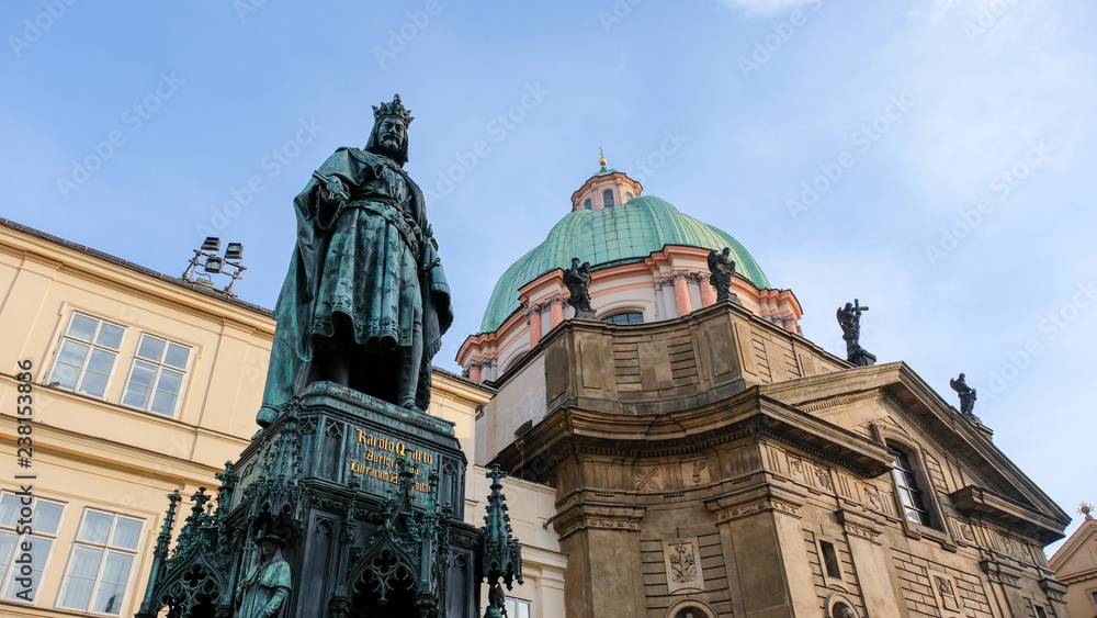 Charles IV Statue next to Prague Charles Bridge. The monument of King Charles IV is one of the best preserved and most significant neo-Gothic statues in Central Europe.