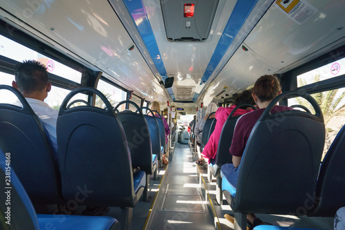 The interior of the public bus traveling to Maspalomas, the passengers are calm and patient