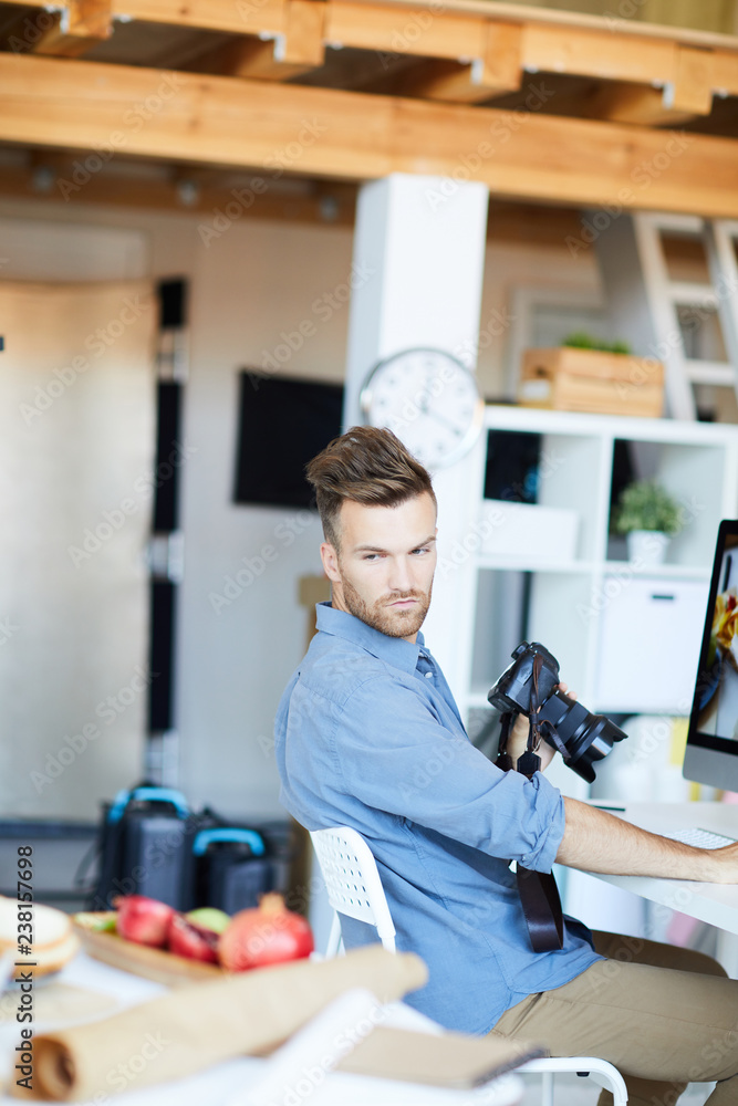 Portrait of handsome young man working with food-photography in studio, copy space Portrait of handsome young man working with food-photography in studio, copy space