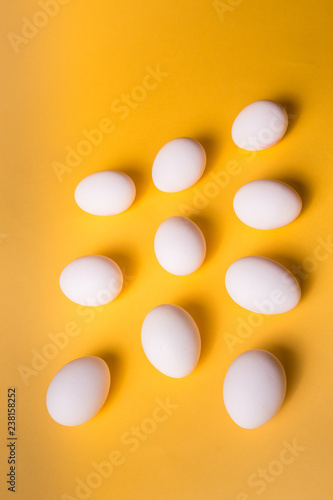eggs pattern over yellow pastel background. Flat lay.
