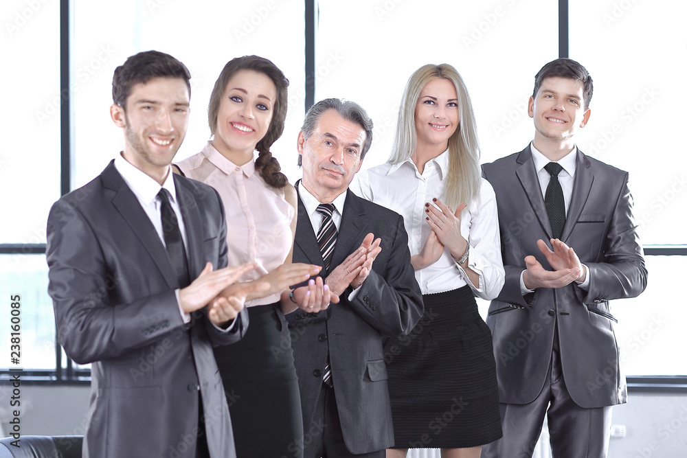 Successful business team applauding at the office Successful business team applauding at the office