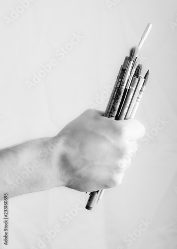 hand holding brushes