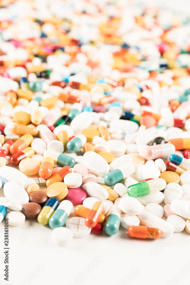 High number of pills on white background surface. High resolution image for pharmaceutical industry. High number of pills on white background surface. High resolution image for pharmaceutical industry.