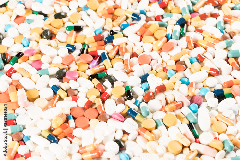High number of pills on white background surface. High resolution image for pharmaceutical industry. High number of pills on white background surface. High resolution image for pharmaceutical industry.
