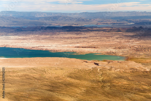 landscape and nature concept - aerial view of grand canyon and lake mead from helicopter
