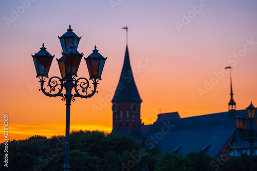 Koenigsberg cathedrlal silhouette at sunset, a street lamp in the foreground photo