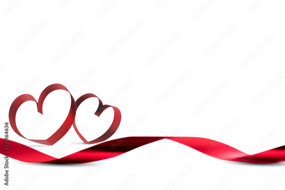 Red ribbons with ribbons shaped as hearts over white background