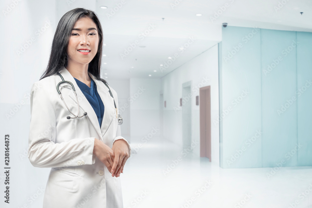 Young asian woman doctor with lab coat and stethoscope Young asian woman doctor with lab coat and stethoscope