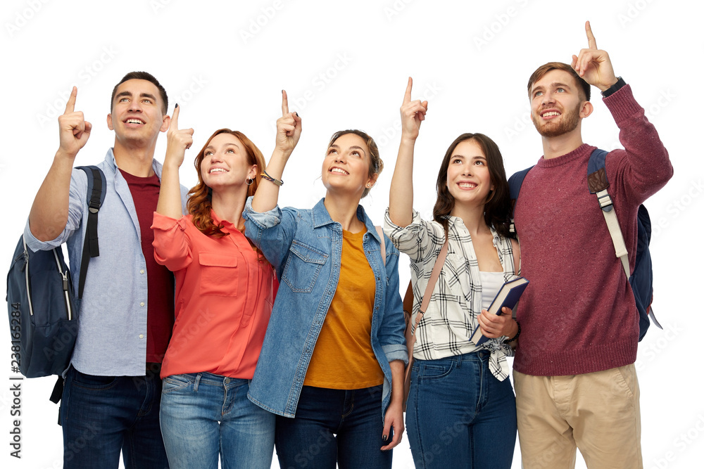 education, high school and people concept - group of smiling students pointing fingers up over white background education, high school and people concept - group of smiling students pointing fingers up over white background