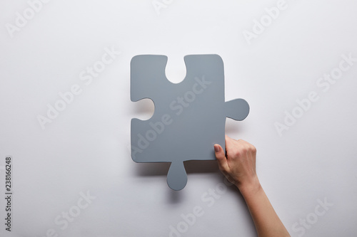 top view of grey puzzle problem solution symbol on grey background