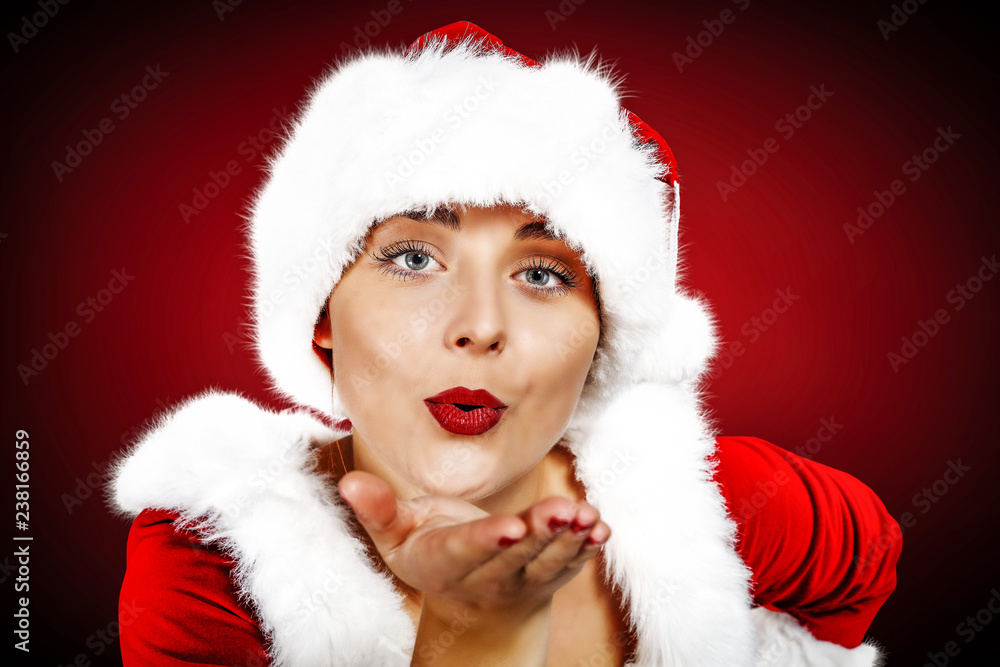 Christmas time and slim young woman on red background Christmas time and slim young woman on red background