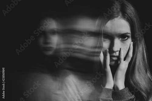 Fototapeta Naklejka Na Ścianę i Meble -  Black and white picture of scared beautiful young redhead woman with post traumatic stress disorder having sleep problems