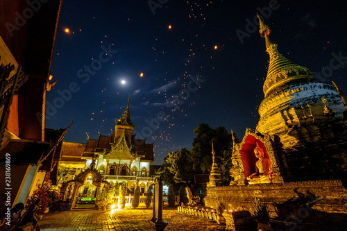 Sky lanterns at Wat Bopparam during Yi Peng festival in Chiang Mai, Thailand