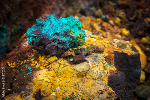 Bright multi-colored minerals on the slope of the volcano (Kamchatka, Russia) Rock formation after eruption.