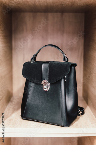 women's black bag in a beautiful interior