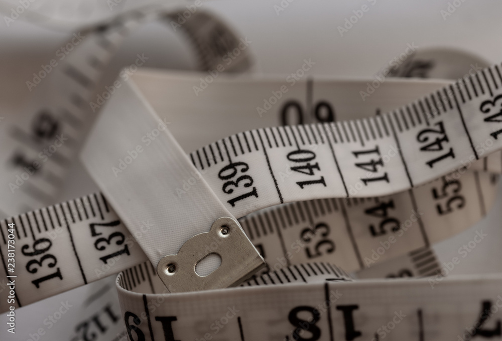 Measuring Tape in a pile showing centimetres Measuring Tape in a pile showing centimetres