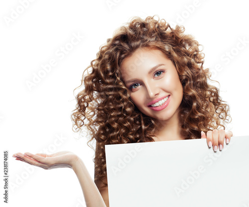 Happy woman with open hand and white empty board background with copy space for advertising marketing or product placement