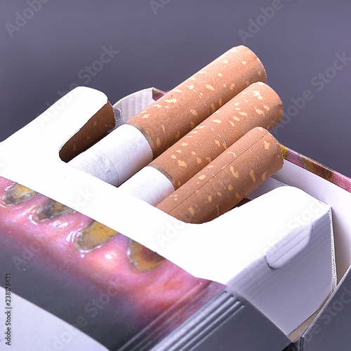 pack of cigarettes with a filter on a gray background for use in the body