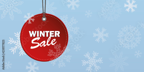 winter sale red label on snowy blue background vector illustration EPS10