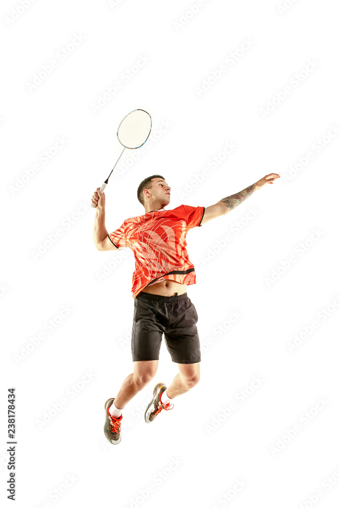 Young man playing badminton over studio background. Fit male athlete isolated on white. badminton player in action, motion, movement. attack and concept Stock | Adobe Stock