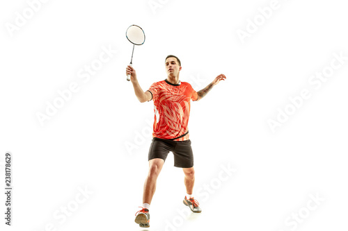 Young man playing badminton over white studio background. Fit male athlete isolated on white. badminton player in action, motion, movement. attack and defense concept © master1305