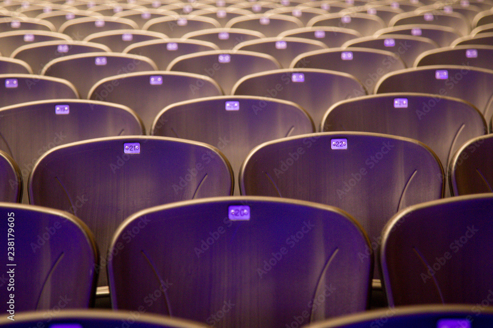 Fototapeta premium Empty comfortable chairs seats with numbers in hall