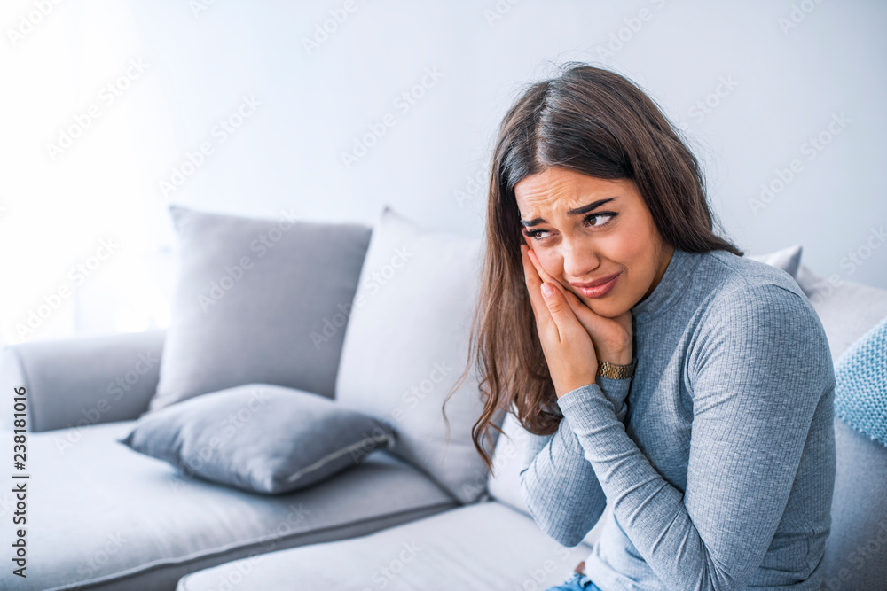 Portrait of young woman with toothache Portrait of young woman with toothache