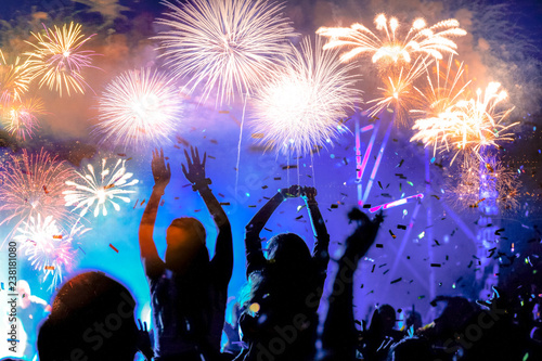 Fototapeta Naklejka Na Ścianę i Meble -  crowd watching fireworks - New Year celebrations- abstract holiday background