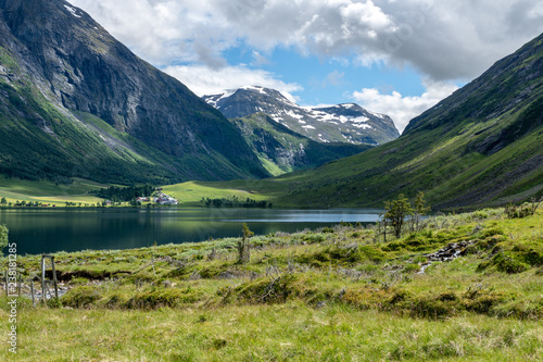  Lake in the valley between two mountainsides in Norway