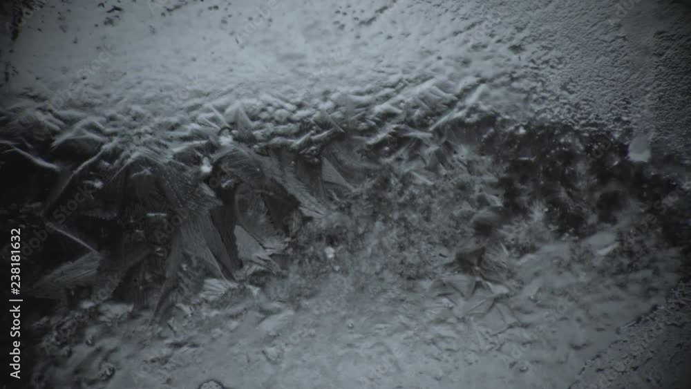 Cold make pattern on the window glass from the water time lapse Cold make pattern on the window glass from the water time lapse