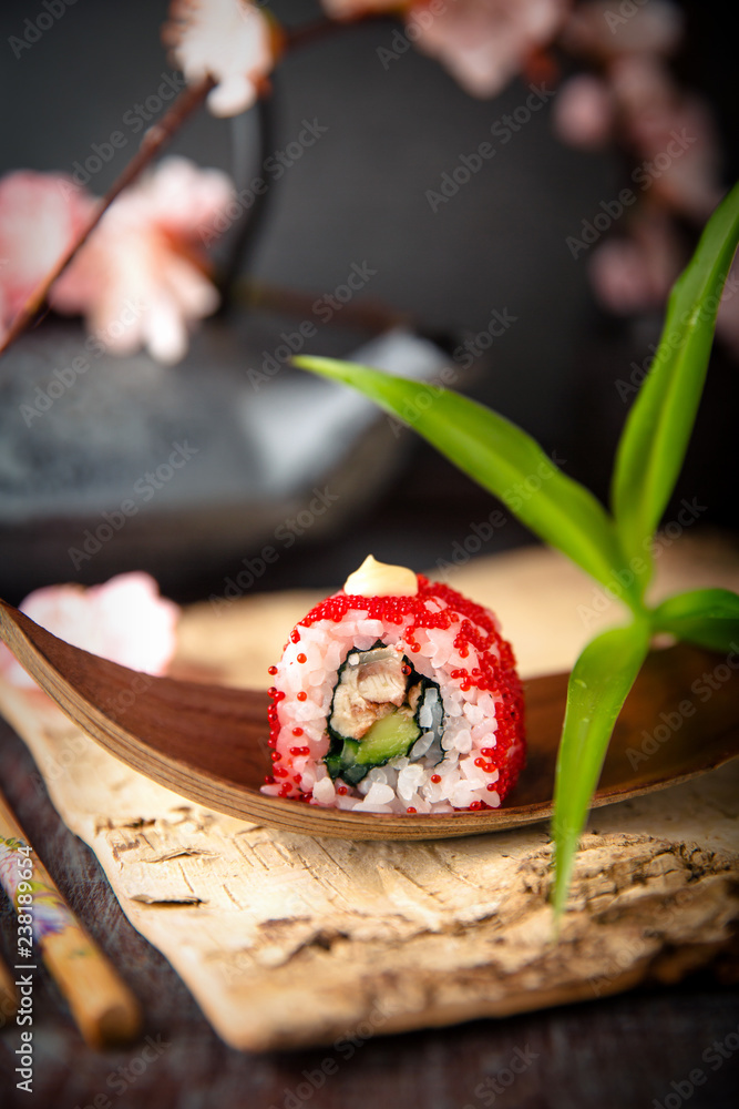 Japanese California Roll with eel, avocado, cucumber, cream with Philadelphia cheese, tobiko caviar and Japanese mayonnaise Sushi menu. Japanese food. Japanese California Roll with eel, avocado, cucumber, cream with Philadelphia cheese, tobiko caviar and Japanese mayonnaise Sushi menu. Japanese food.