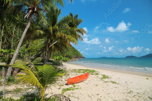 Red canoe on the beautiful tropical beach